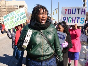 Ebony leading a march for the Youth Resiliency Institute